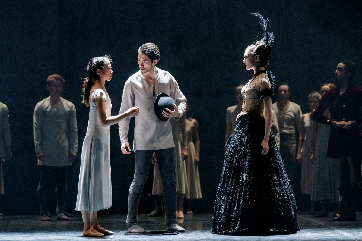 Erina Takahashi as Giselle, Ken Saruhashi as Hilarion and Angela Wood as Bathilde in Akram Khan's Giselle. Photo by Camilla Greenwell