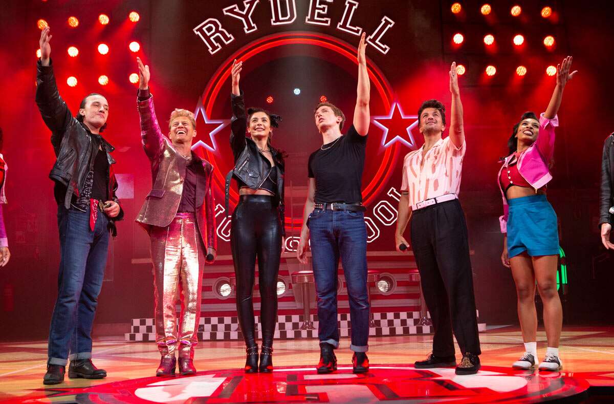 LtoR Paul French, Jason Donovan, Olivia Moore, Dan Partridge, Peter Andre, Lizzy-Rose Esin-Kelly at the curtain call for Grease, credit Piers Allardyce